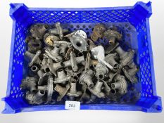 A crate of vintage metal door handle fittings