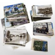 A box of monochrome and colour postcards.