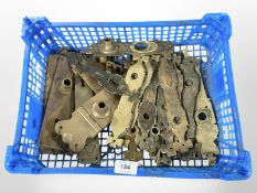 A crate of vintage brass door plates