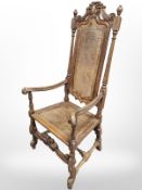 A continental carved beech bergere high-back armchair