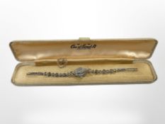 A small gold heart-shaped pendant and a lady's silver and marcasite wristwatch in Ciro box