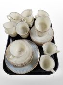 A quantity of vaseline glass tea wares.