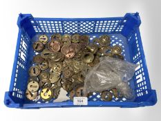 A crate of brass lock escutcheons