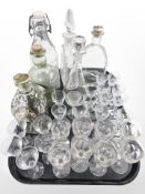 A group of Scandinavian glass wares including various decanters and bottles, drinking glasses, etc.