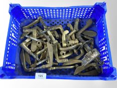 A crate of vintage brass door handles
