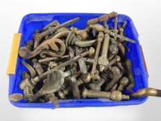A tub of vintage brass door handles