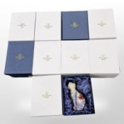 Eight matching Old Tupton Ware ceramic cat figurines, height 15cm, all boxed.