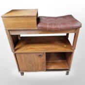 A 20th century teak sliding door low cabinet,