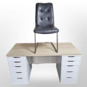 A modern twin pedestal desk, 140cm wide x 60cm deep x 73cm high,