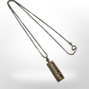 A 9ct gold ingot pendant, pendant 23mm long.