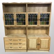 A 20th-century Danish blonde oak two-section dresser with stained and leaded glass cabinet doors,