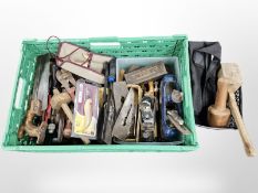 A quantity of woodworking tools including Stanley and Record planes, wooden mallets, saws,