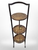 An Edwardian oak cake stand.