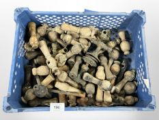 A crate of vintage wooden door handles