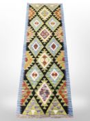 A Chobi Kilim runner, 197cm x 68cm.