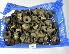 A crate of vintage brass door handle collars and fittings