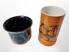A Poole vase and pot, tallest 23cm.