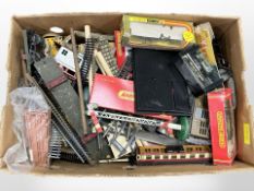 A quantity of tin-plate and Hornby OO gauge rolling stock, model railway buildings and components,