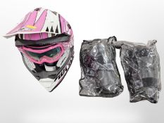 A Wulf Sport girl's helmet with riding gloves and knee pads