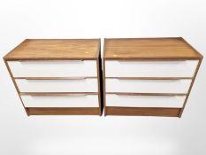 A pair of teak and MDF three drawer chests,