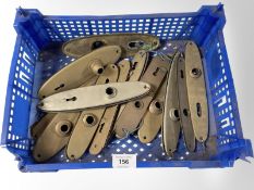 A crate of brass finished door handle plates