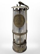 An Eccles type 6 miner's safety lamp.