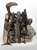 Two cast-iron cobbler's lasts, irons, antique hand drill, bracers, etc.