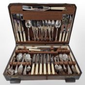 An oak canteen of EPNS cutlery.