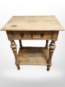 A blond oak two tier side table,
