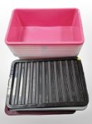 Eight plastic storage boxes with lids.