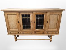 A Danish blond oak and leaded stained glass sideboard,