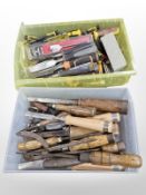 Two plastic trays containing masonry and carpentry chisels and other tools.