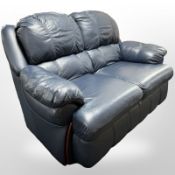 A contemporary blue leather two seater settee,