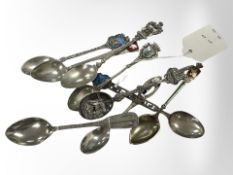 Nine assorted silver and enamel spoons.