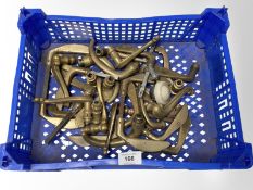 A crate of various brass door handles