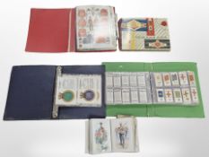 Several albums of cigar bands, Players and Wills cigarette cards, naval ship collector's cards, etc.