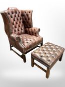 A brown buttoned and studded leather Chesterfield wing back armchair and matching rectangular