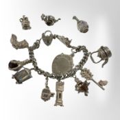 A silver charm bracelet CONDITION REPORT: 99g