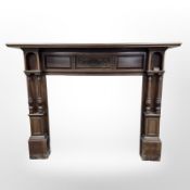 An Art Nouveau carved walnut fire surround,