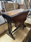 A reproduction drop leaf table and a pair of spindle back dining chairs