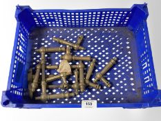 A crate of vintage brass door handles