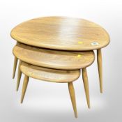 An Ercol nest of three elm and beech 