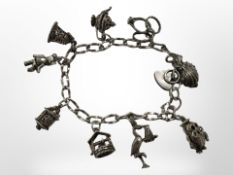 A silver charm bracelet CONDITION REPORT: 26.