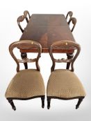 A Victorian style mahogany extending dining table with one leaf and a set of six dining chairs