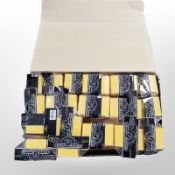 A box of Deck Armor trading card protective boxes, all in retail cellophane.