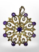 A 9ct gold amethyst and seed pearl brooch/pendant, diameter 3cm.