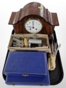 An Edwardian mahogany eight day mantel clock, set of knives and forks with faux ivory handles, etc.