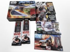 A group of Hasbro Disney Star Wars figurines and collectibles including Tie Striker model,