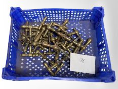 A crate of vintage brass door handles.