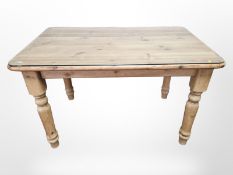 A pine farmhouse table with plate glass top,